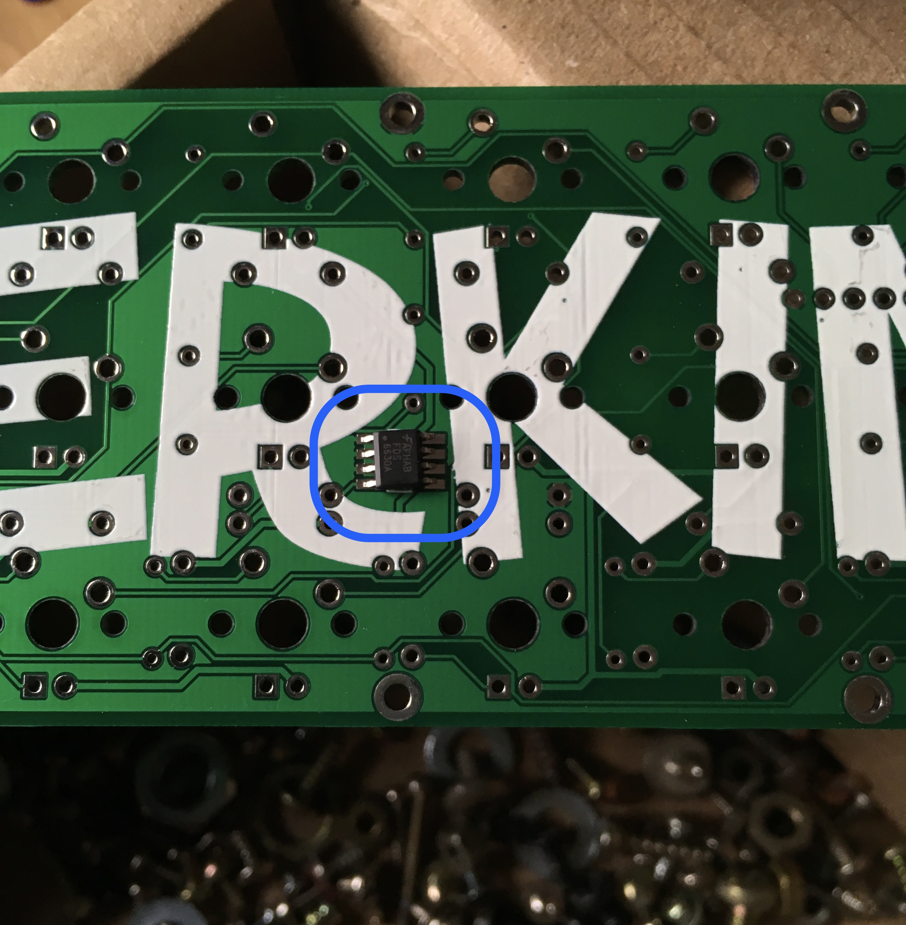 The FET before soldering, correctly oriented.