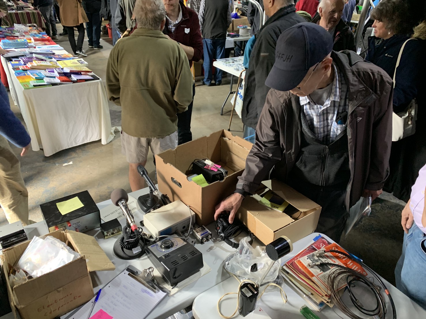 A table at Westrally, various bits of radio equipment and junk adorn the tables.