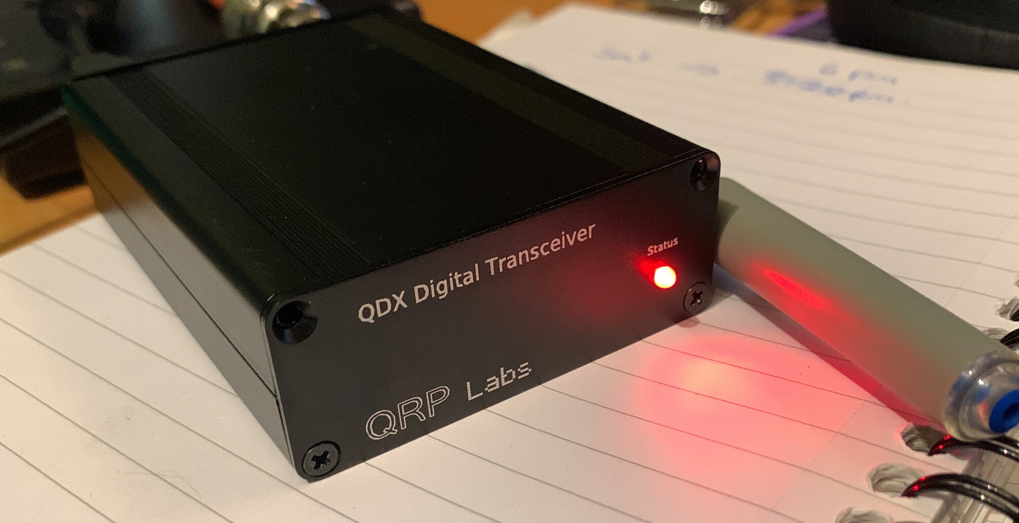 A QDX in its enclosure. It’s a small black box 7x9x2.5cm in size with an LED on the front left and connectors on the back (not shown here)